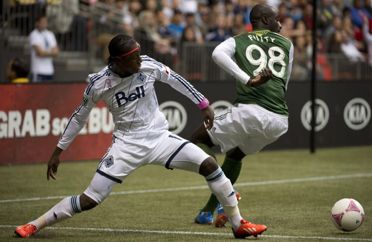 Portland's Mamadou &quot;Futty&quot; Danso (98), here against Vancouver's Darren Mattocks, has been a solid defender.