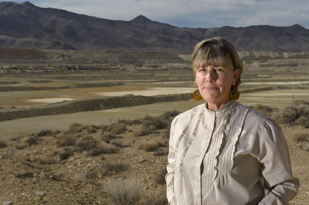 Peggy Pauly, who formed Yearington&#039;s first citizen advocacy group to address the water contamination from the former Anaconda copper mine site near Yearington, Nev., is pictured in 2009 in front of the leach ponds that are responsible for most of that contamination.