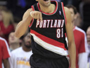 Portland Trail Blazers' Nicolas Batum celebrates after making a 3-point shot to give the Trail Blazers a win in double overtime over the Cleveland Cavaliers on Saturday.