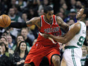 Portland Trail Blazers' LaMarcus Aldridge (12) looks to move against Boston Celtics' Jason Collins (98) in the first quarter Friday.