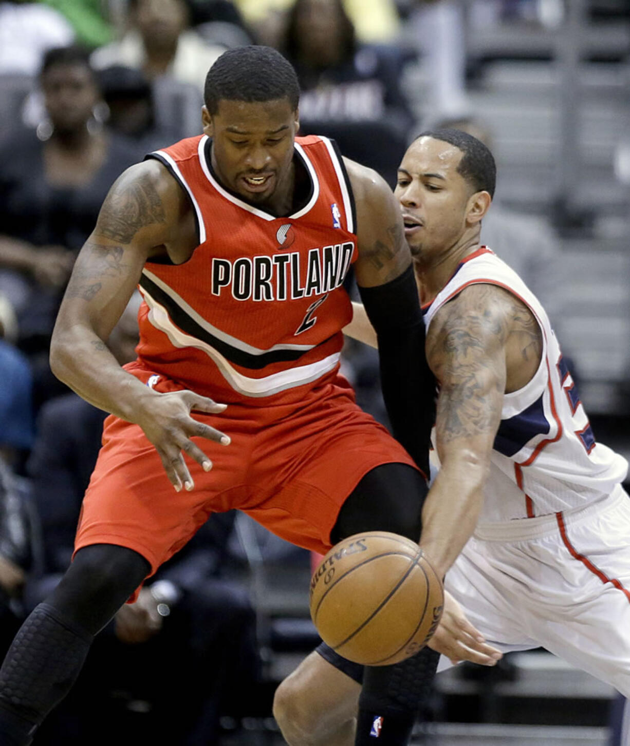 Atlanta Hawks' Devin Harris, right, guards Portland's Wesley Matthews.