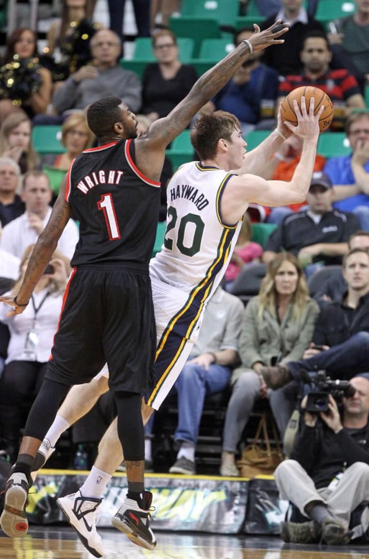 Portland Trail Blazers' Dorell Wright (1) defends Utah Jazz's Gordon Hayward (20) in a preseason game Oct.