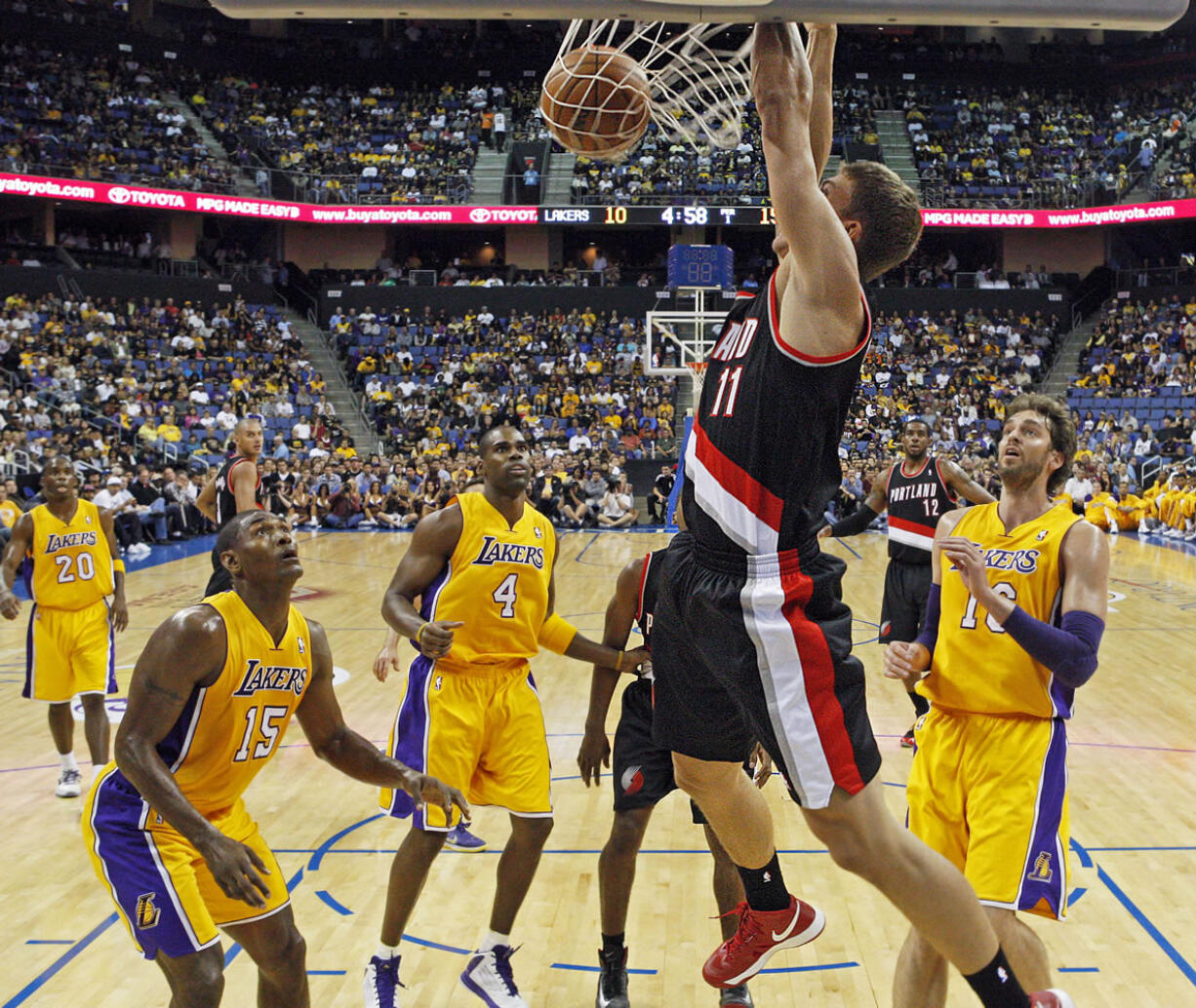 Portland Trail Blazers center Meyers Leonard slam dunks over Los Angeles Lakers during Wednesday's preseason game at Ontario, Calif.