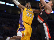 Los Angeles Lakers guard Kobe Bryant (24) goes up for a shot as Portland Trail Blazers center Meyers Leonard defends during the first half Friday.