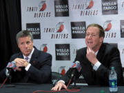 Trail Blazers' new head coach Terry Stotts, right, with general manager Neil Oshey, says plenty of good coaches had losing records in the early parts of their careers.