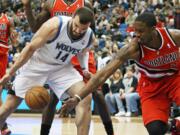 Portland Trail Blazers' Wesley Matthews, right, and Minnesota Timberwolves' Nikola Pekovic, go for the loose ball in the first quarter Saturday.