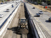 Vehicles pass a highway construction site on eastbound Interstate 80 in Sacramento, Calif. The House and Senate have reached agreement on a 5-year, $281 billion transportation bill that would increase spending to address the nation&#039;s aging and congested highways and transit systems -- a legislative feat that lawmakers and President Barack Obama have struggled throughout his entire administration to achieve.