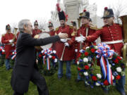 Director Steven Spielberg, left, greets members of &quot;The President's Own Band,&quot; a musical group of Civil War re-enactors, during a ceremony to mark the 149th anniversary of President Abraham Lincoln's delivery of the Gettysburg Address at Soldier's National Cemetery in Gettysburg, Pa.