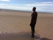 This July 18, 2015, photo shows one of the 100 sculptures permanently on Crosby Beach near the north end of Liverpool, England. Liverpool is best known among travelers for its connection to two of the Beatles, John Lennon and Paul McCartney. But there are many other attractions and sights around the city for visitors to see.