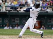 Seattle Mariners' Nick Franklin connects on a three-run home run against the Minnesota Twins in the fourth inning Sunday.