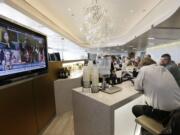 United Airlines passengers enjoy the United Club as they wait for their flights at O'Hare International Airport in Chicago.