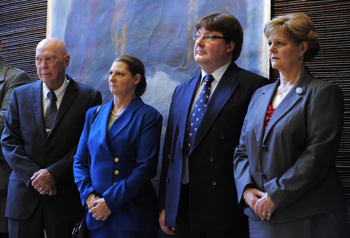 In the image taken Monday Oct. 24, 2011 John Wesley Walker, left, and his wife Princess Irina of Romania, center left, Alexander Phillips Nixon, center right, and Princess Elena of Romania attend the opening of an exhibition in Bucharest.  A Romanian princess and her husband, a former sheriff's deputy, are apparently among several people federal agents arrested in Eastern Oregon on Thursday Aug. 15, 2013 in connection with an alleged cockfighting ring. Indictments unsealed in U.S. District Court in Portland charge Irina Walker, 60, and her husband John Wesley Walker, 67, with hosting cockfighting derbies and illegal gambling at their ranch outside the small Morrow County town of Irrigon.