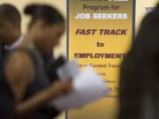 Job seekers line up to talk to recruiters during a job fair held in Atlanta in May.