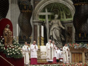 Pope Francis holds the pastoral staff as he celebrates the Christmas Eve Mass in St. Peter&#039;s Basilica at the Vatican on Thursday.