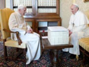 Pope Francis, right, and Pope emeritus Benedict XVI meet in Castel Gandolfo on March 23, 2013.