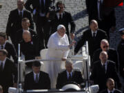 Pope Francis waves upon his arrival in St.