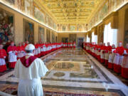 Pope Francis stands with cardinals during a consistory at the Vatican in September.