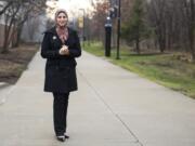 Suehaila Amen, coordinator of International Admissions and Recruitment at the University of Michigan Dearborn, is seen on campus Thursday in Dearborn, Mich. Amid the high level of harassment, threats and vandalism directed at American Muslims and at mosques, Muslim women are intensely debating the duty and risks related to wearing their head-coverings as usual.