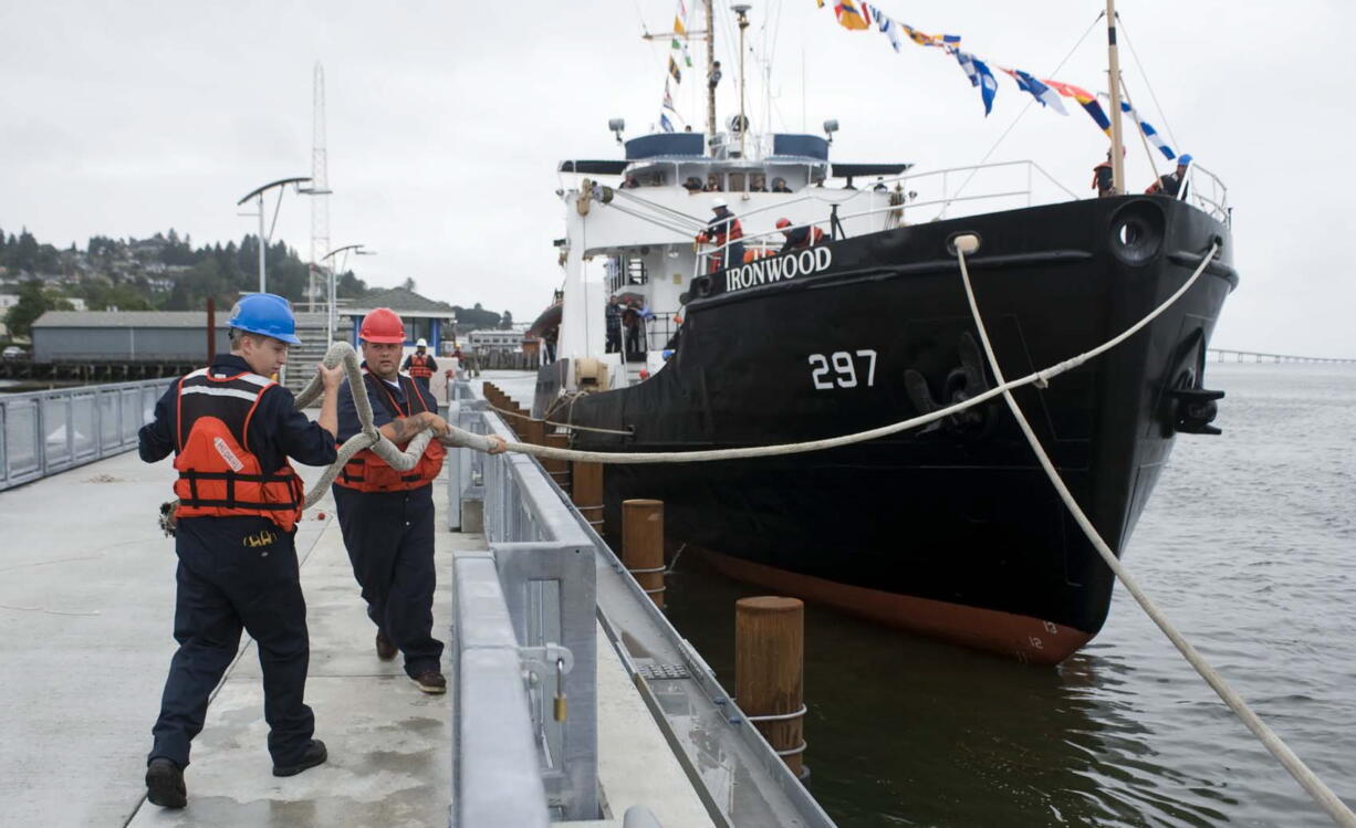 Tongue Point Job Corps seamanship students Blake Hedahl, left, of Snohomish, and Nicolas Espinoza, of San Pedro, Calif., secure a bow line from the 180-foot Ironwood to the 17th Street Pier on Friday in Astoria, Ore.