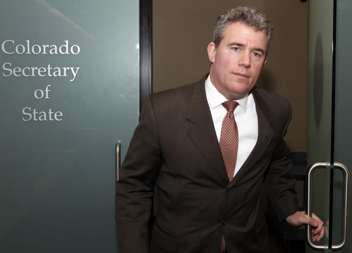 Colorado Secretary of State Scott Gessler leaves his office in Denver. Republican election officials who were swept into office on promises to root out voting fraud say they're doing just that.