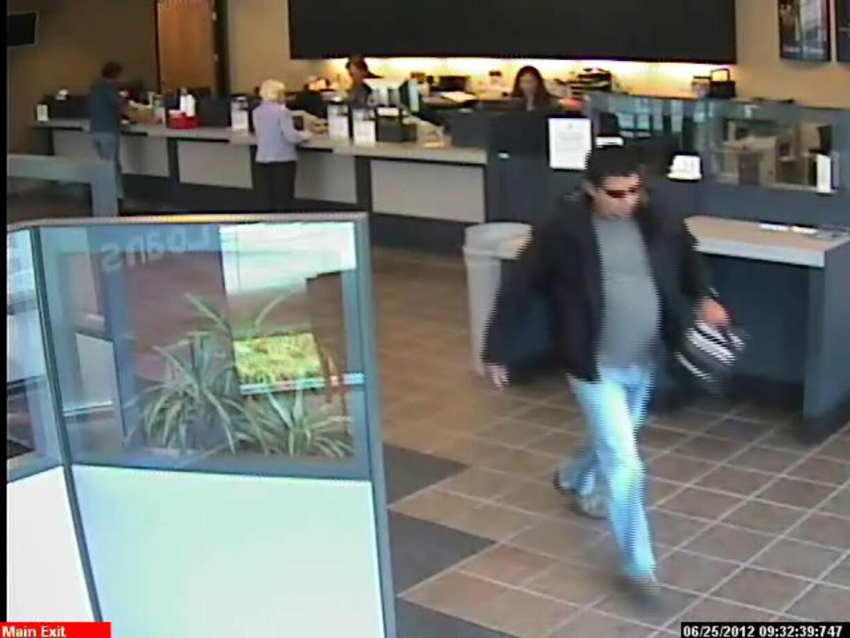 A bank surveillance photo shows a man accused in the June 25 robbery of a West Coast Bank branch in Salmon Creek.