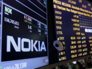 The Nokia brand name is displayed on the floor of the New York Stock Exchange in New York on Tuesday.