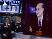 A television screen on the floor of the New York Stock Exchange shows the news conference of Federal Reserve Chairman Ben Bernanke on Wednesday.