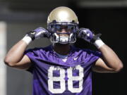 Washington's Austin Seferian-Jenkins adjusts his helmet at the team's first football practice earlier this month.