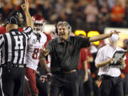 Washington State coach Mike Leach pleads his case after a penalty called against the Cougars last season at Auburn.