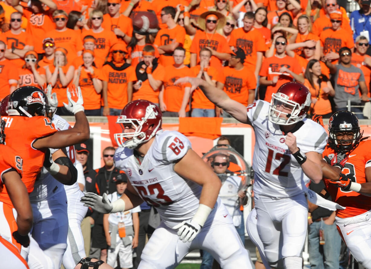 Washington State quarterback Connor Halliday (12) threw three interceptions in the first half Saturday before being replaced by Jeff Tuel.