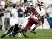 Washington's Marquess Wilson runs with the ball after making a reception during the second half of the NCAA college football game between the BYU Cougars and the Washington State Cougars at LaVell Edwards Stadium in Provo, Utah on Thursday, Aug. 30, 2012. BYU went on to beat Washington State 30-6.