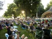 Music fans listen to the Tacoma band Junkyard Jane on the opening night of the 2011 Vancouver Wine and Jazz Festival at Esther Short Park.