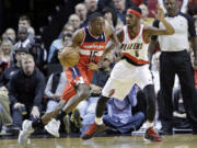 Washington Wizards guard Jordan Crawford, left, drives on Portland Trail Blazers guard Will Barton during the second half Monday.