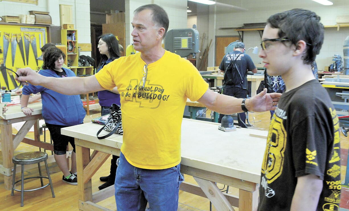 Woodshop teacher Brad Cohn directs a student in the class Oct. 23 at North Bend High School in North Bend, Ore.