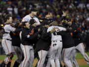 The San Francisco Giants celebrate after winning Game 4 of the World Series.