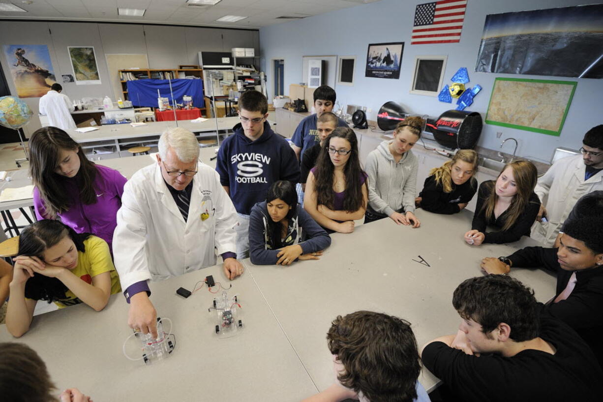 Skyview High School science teacher Mike Murray teaches freshmen physical science students about alternative fuels on June 7, 2011.