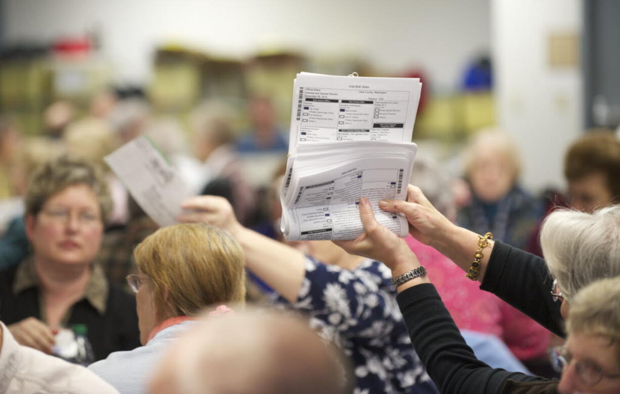 Election Officials sort through ballots at the Clark County Elections Office on Nov.