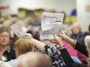 Election Officials sort through ballots at the Clark County Elections Office on Nov.