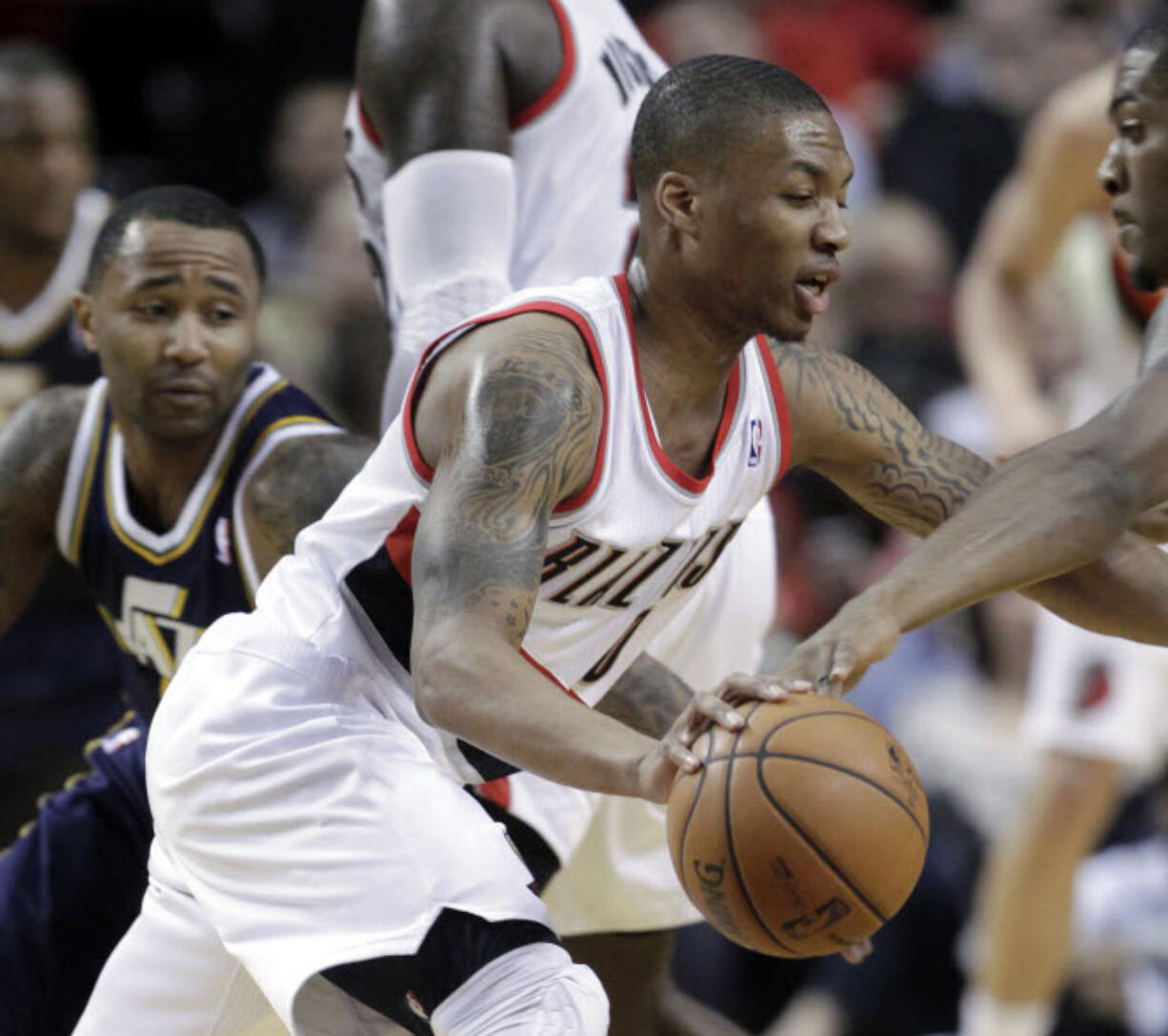 Mo Williams, left, attempts to guard Damian Lillard while playing for Utah last season.