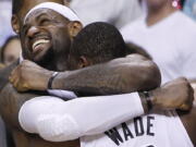 Miami's LeBron James and Dwyane Wade celebrate winning the NBA title on Thursday.