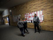 Vancouver Public Schools Resource Officer Donald &quot;Raven&quot; Hubbard makes sure children are headed to class at the start of the school day at McLoughlin Middle School on Feb.