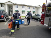 Vancouver Fire Department firefighters respond to a medical call near General Anderson Road in Vancouver.