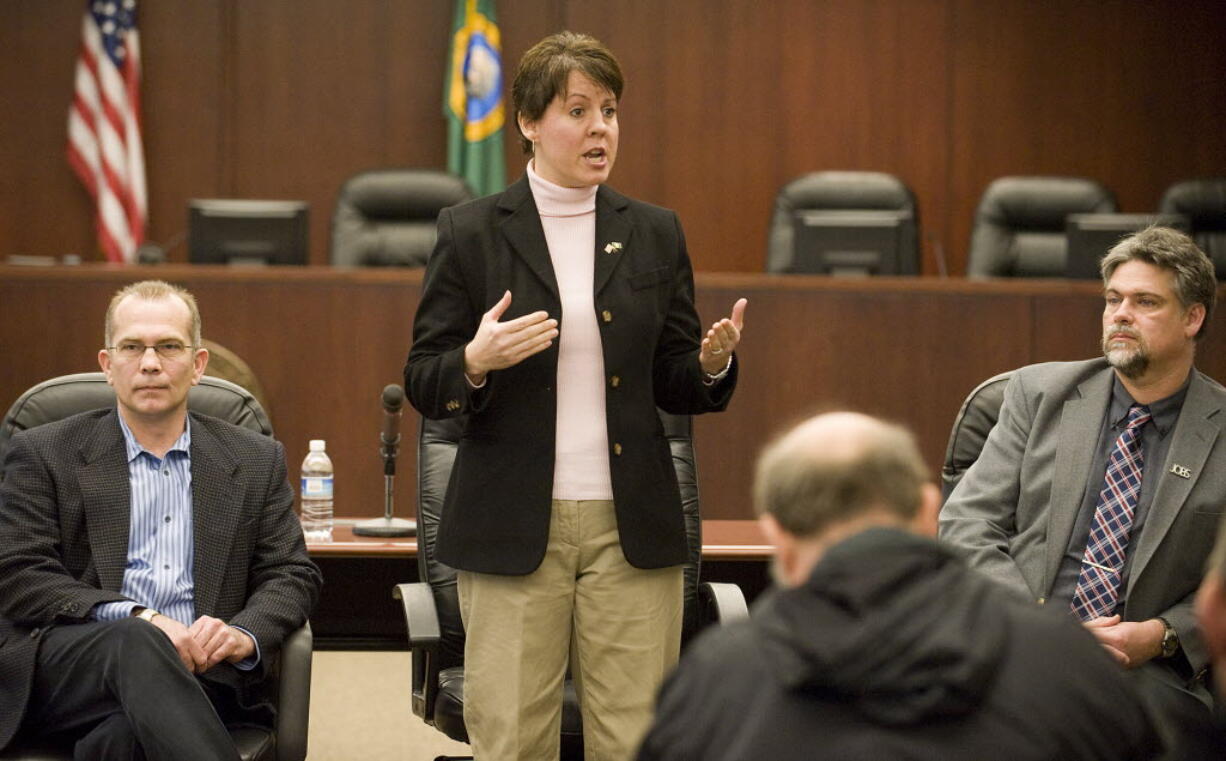 State Rep. Anne Rivers, flanked by then-Sen. Joseph Zarelli, left, and state Rep. Ed Orcutt, speaks at a town hall meeting in Battle Ground in February.