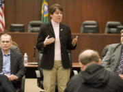 State Rep. Anne Rivers, flanked by then-Sen. Joseph Zarelli, left, and state Rep. Ed Orcutt, speaks at a town hall meeting in Battle Ground in February.