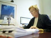 Judge Diane Woolard, photographed here in her office late last year, will retire from the bench.