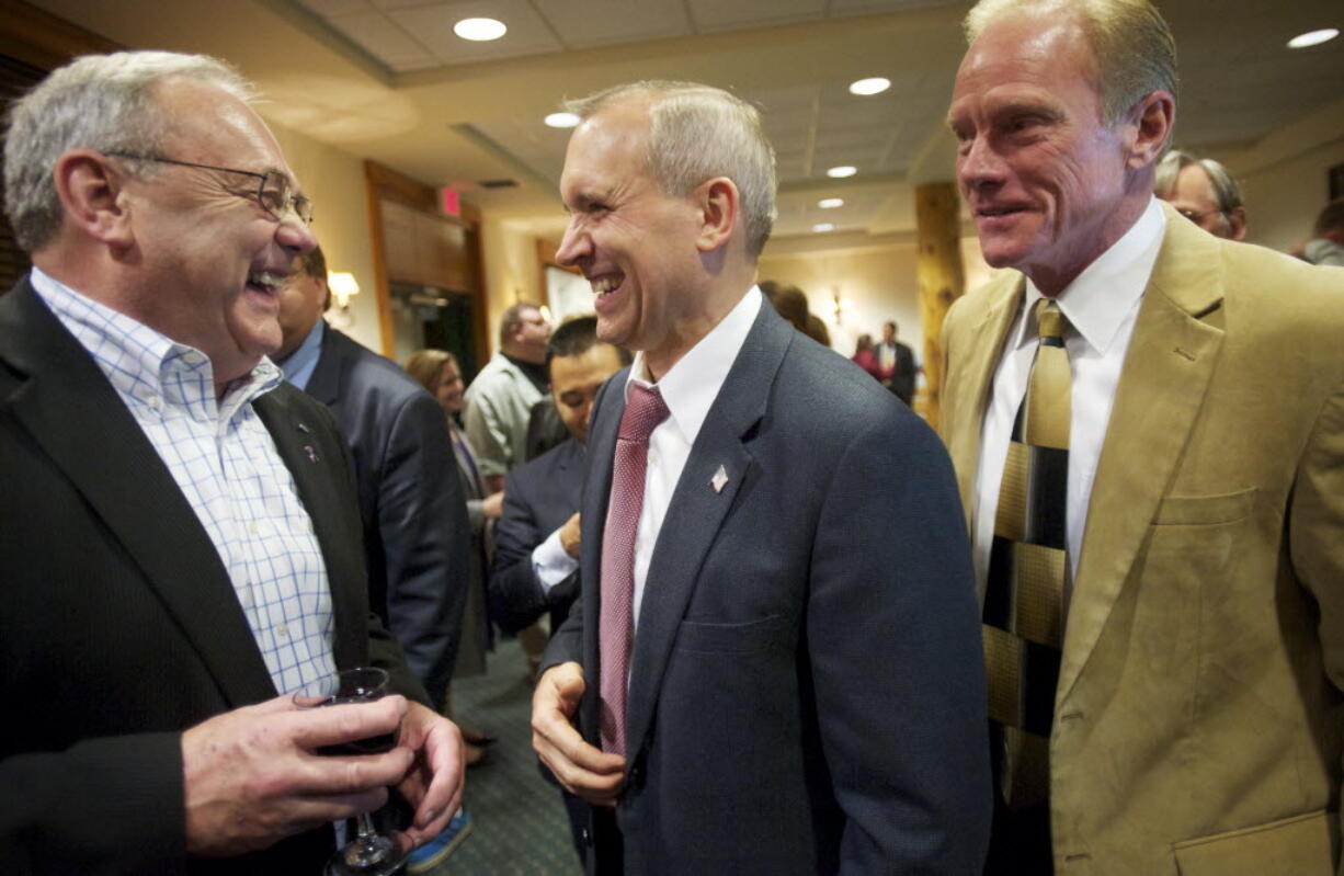 Tom Mielke, from left, David Madore and Paul Harris attend an election night reception at the Heathman Lodge on Nov. 6. Meilke and Madore currently serve on the Clark County Board of Commissioners.