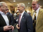 Tom Mielke, from left, David Madore and Paul Harris attend an election night reception at the Heathman Lodge on Nov. 6. Meilke and Madore currently serve on the Clark County Board of Commissioners.