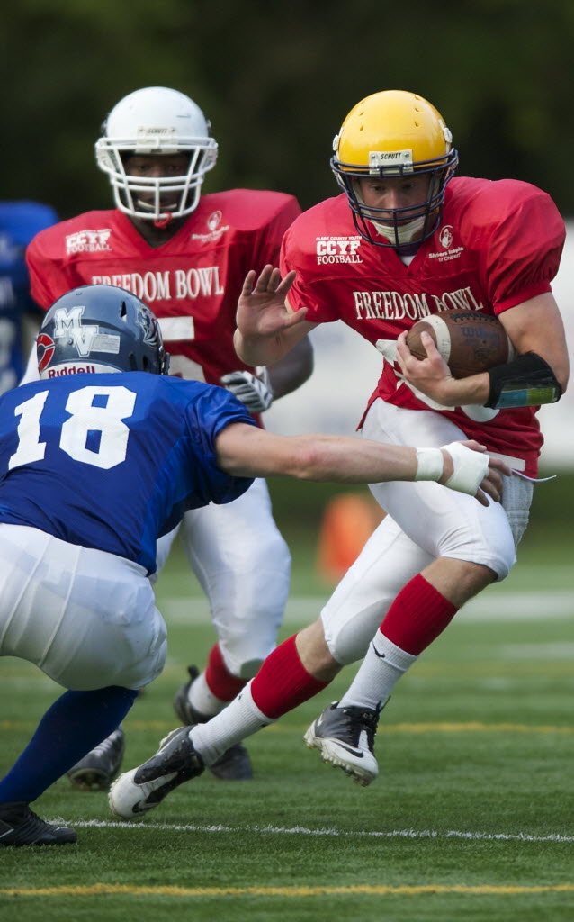 The West's Dennis Henderson runs the ball in the first half of the annual Freedom Bowl Classic at Kiggins Bowl on Saturday.