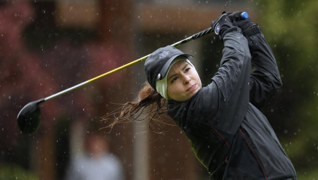 Columbia River's Chloe Bartek hits a tee shot on 10th hole Wednesday at Lewis River Golf Course during second round of 3A girls state championship.