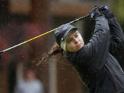 Columbia River's Chloe Bartek hits a tee shot on 10th hole Wednesday at Lewis River Golf Course during second round of 3A girls state championship.